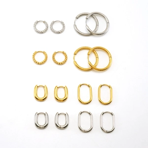 Minimalist geometric earring set with round and oval gold and silver steel hoops