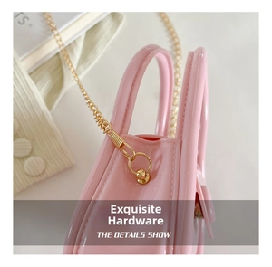 Detail showing polished gold hardware and pink jelly texture of the mini chain bag