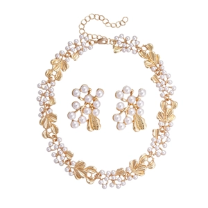 Vintage gold leaf and pearl jewelry set with elegant necklace and matching earrings