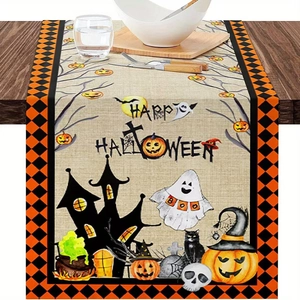 Halloween linen table runner with pumpkins and ghosts on a rustic wooden dining table