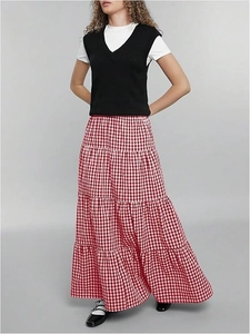 Detailed view of red and white plaid layered skirt with high waist and A-line silhouette