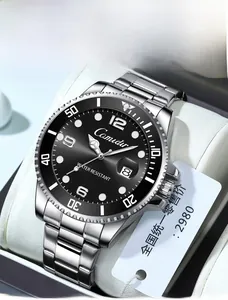 Close-up of Camidur silver steel watch with black dial and luminous markers