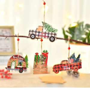 Detailed view of wooden Christmas car pendants with plaid patterns hanging on a branch