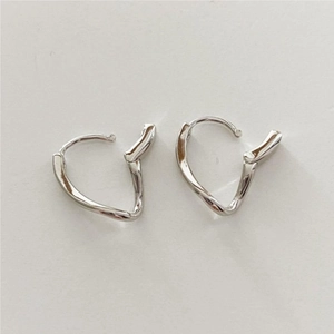 Detailed view of silver minimalist irregular twisted hoop earrings with buckle closure