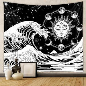 Detail of minimalist black and white tapestry showing sun, moon phases and ocean waves