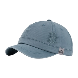Blue washed cotton short brim baseball cap with vintage distressed details and side label