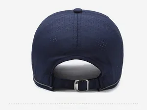 Detail of breathable perforated fabric and adjustable metal buckle on navy baseball cap