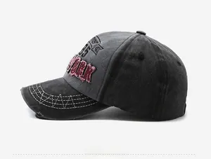 Detail of vintage gray baseball cap showing red York embroidery and distressed brim texture
