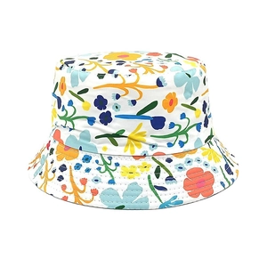 Detailed close-up of floral bucket hat showing colorful patterns and reinforced stitching