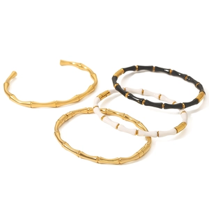 Minimalist C-shaped bamboo link bracelets in gold and two-tone stainless steel finish