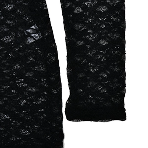 Detailed close-up showing the intricate floral lace patterns and sleeve texture of the black set