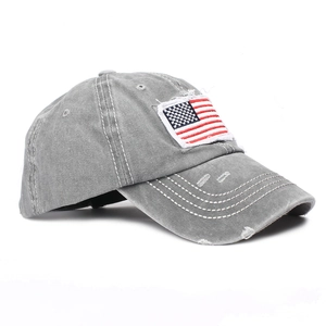 Detail of vintage washed gray cotton baseball cap with American flag embroidery patch