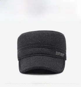 Detail view of winter flat cap for elderly men with gray SPIRIT embroidery and thick knit fabric