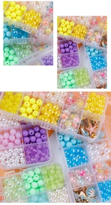 Detail of DIY jewelry making kit with various beads and ocean theme metal charms