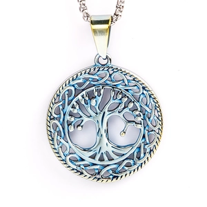 Detailed view of stainless steel Tree of Life pendant with intricate hollow design on white background