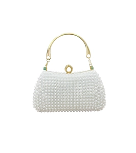 Detail of elegant pearl evening bag featuring gold metal handle and crystal clasp