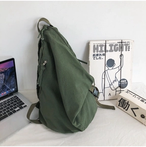 Detail shot of army green canvas messenger bag with durable strap and buckle