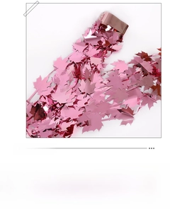 Close-up of metallic rose pink maple leaf foil fringe curtain for party background decor