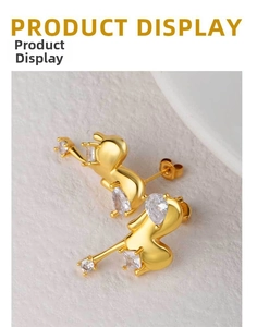 Detailed macro view of 18K gold plated heart earrings with sparkling zircon gemstones