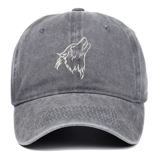 Detailed view of wolf head embroidery on dark grey washed cotton baseball cap