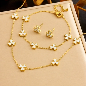 Elegant gold clover jewelry set with white shell inlay necklace bracelet and earrings