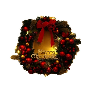Christmas wreath with red bow, golden balls, LED lights and Merry Christmas sign on white background