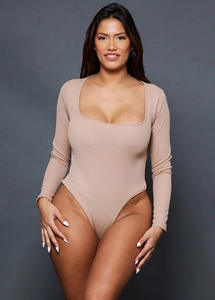 Close-up of beige ribbed bodysuit featuring a square neckline and long sleeve design