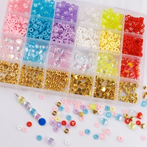 24-grid DIY jewelry kit with colorful clay beads, heart beads, and elastic string tools