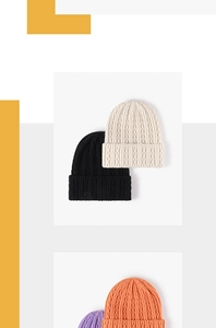 Close-up of thick cable knit texture on various colored winter beanie hats
