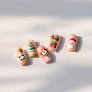 3D embossed Christmas nail stickers with Santa Claus and panda designs on nude pink base