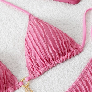 Pink textured bikini top with crystal gold chain and drawstring ties on faux fur