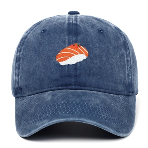 Close-up of salmon sushi embroidery on navy blue washed denim vintage baseball cap