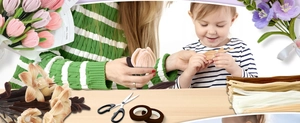 DIY flower making kit showing pipe cleaners, scissors and handmade floral scene