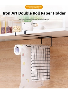 Detail of black metal paper towel holder showing dual-row under-cabinet hanging design