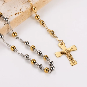 Retro stainless steel beaded necklace featuring a gold crucifix cross and portrait pendant