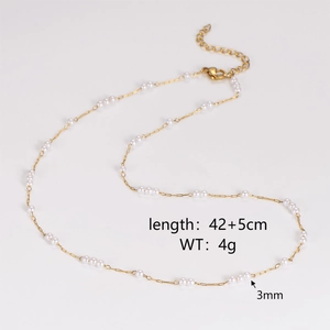 Detail showing 42+5cm length and 3mm pearl size on vintage heart gold chain necklace