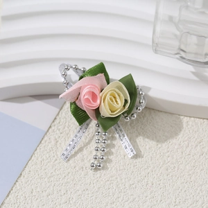 Exquisite pink and yellow handmade ribbon rose brooch with green leaves and bead chain