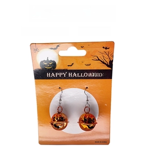 Macro view of pumpkin bell earrings with cutout faces and Happy Halloween card