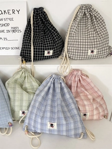 Fashionable checkered drawstring backpack in various pastel colors and canvas material