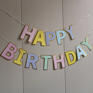 Pastel Happy Birthday daisy banner with gold trim for kids party room decoration