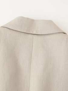 Macro shot of sleeveless vest back neckline stitching and linen fabric texture