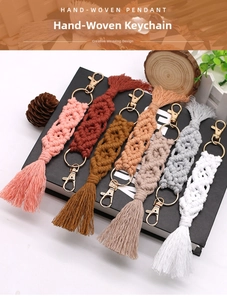Detail of colorful hand-woven macrame keychains with tassels and golden metal clasps