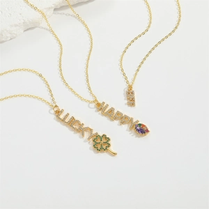 Golden necklace collection with LUCKY, HAPPY and BEST pendants inlaid with zircons