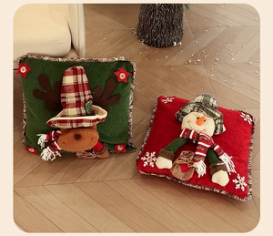 Detail of Christmas pillowcases featuring 3D reindeer and snowman on plush fabric