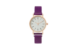 Detailed macro of a rose gold quartz watch with a purple Milanese magnetic mesh strap