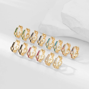 Set of 7 pairs of gold-plated hoop earrings with colorful zircon stones in various hues