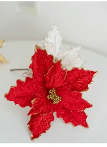 Macro shot of 25cm red velvet poinsettia Christmas flower with gold glitter and wire stem