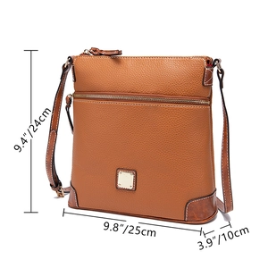 Detailed view of brown pebbled leather texture on a crossbody bag with size measurements