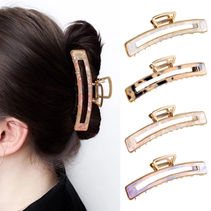 Set of 4 vintage acetate claw clips in marble and leopard patterns for elegant hair styling