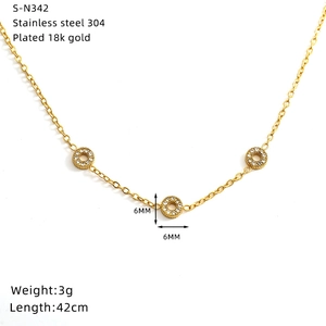 Macro shot of gold-plated stainless steel necklace with 6mm crystal pendant details